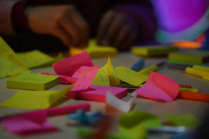 a table topped with lots of post it notes